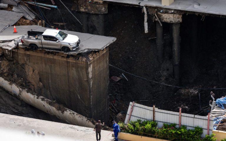 Massive sinkhole opens near Bangkok hospital, swallows cars, power poles