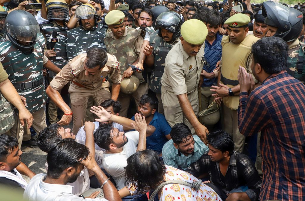 Cockroach Janta Party (CJP) founder Abhijeet Dipke with supporters takes part in a protest demanding the resignation of Union Education Minister Dharmendra Pradhan over alleged examination-related lapses