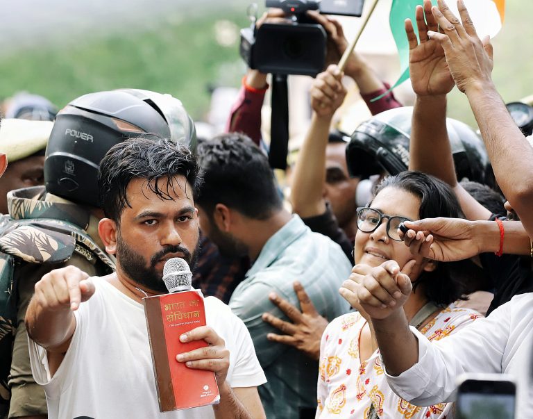 Cockroach Janta Party (CJP) founder Abhijeet Dipke speaks during a protest demanding the resignation of Union Education Minister Dharmendra Pradhan over alleged examination-related lapses