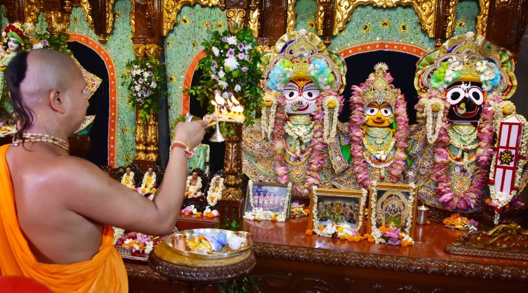 A temple priest performs Jagannath puja