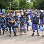 RAF personnel stand guard during the Cockroach Janta Party (CJP) protest
