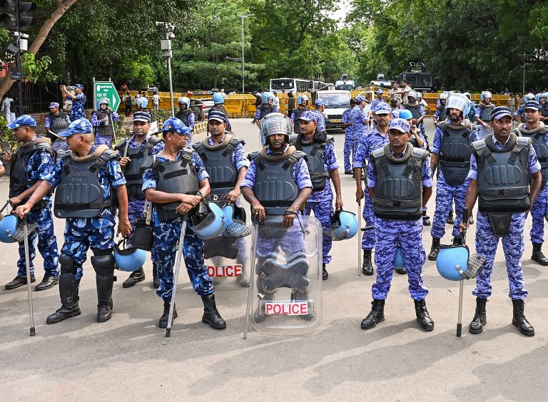 RAF personnel stand guard during the Cockroach Janta Party (CJP) protest