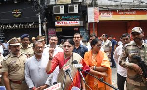 West Bengal Cabinet Minister Agnimitra Paul speaks with the media at the site after a fire broke out at a dingy five-storey building