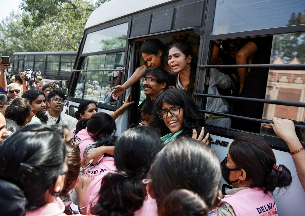 Pink Force of the Delhi Police detains protesters near the Connaught Place area amid the CJP protest