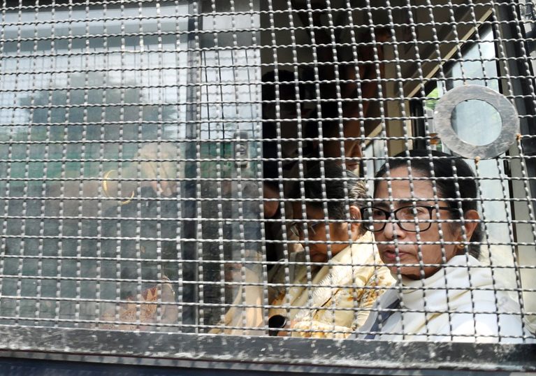 Police detain TMC chief Mamata Banerjee during a protest